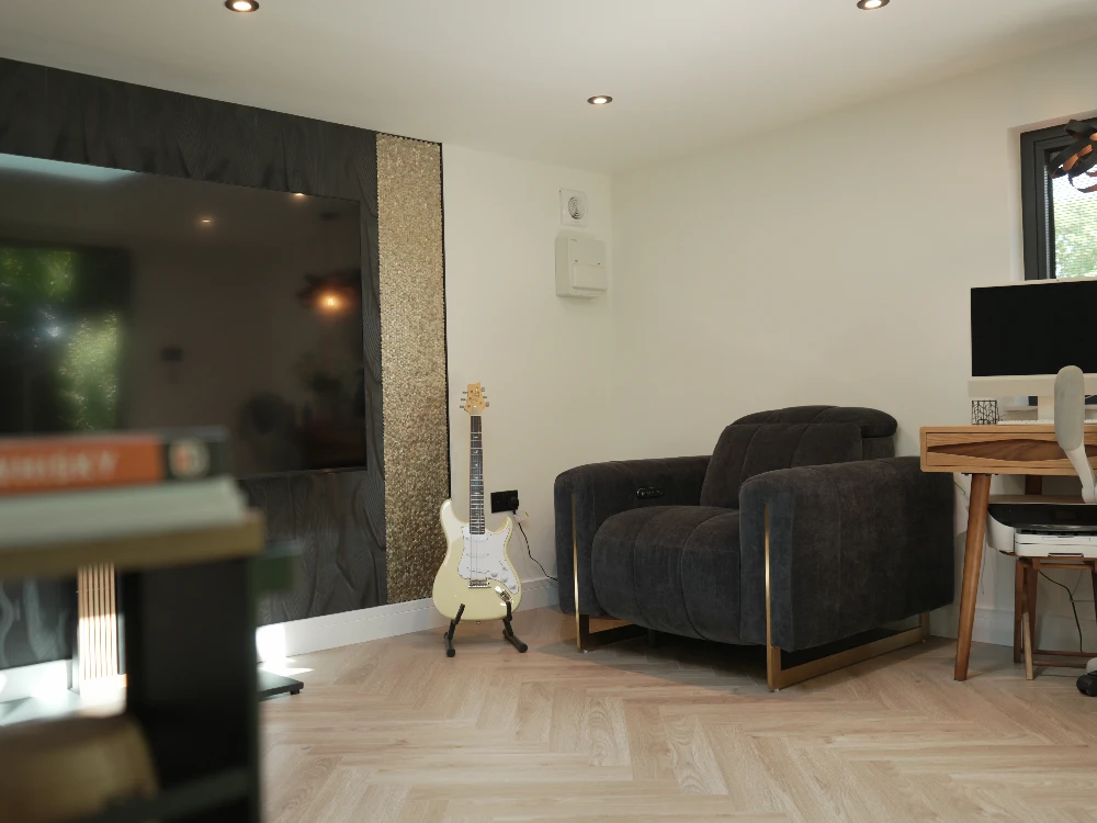 Close up of the garden room's dark cladding and exterior light