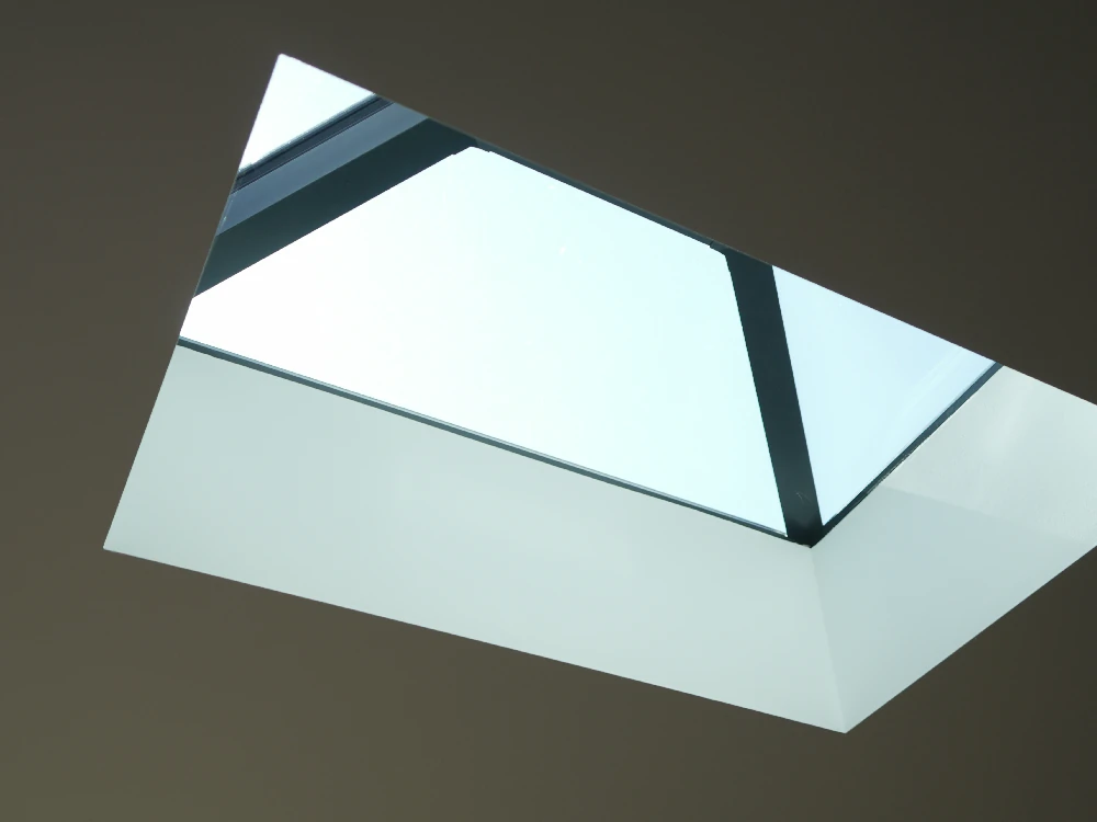 Garden room interior with a lantern rooflight and seating area