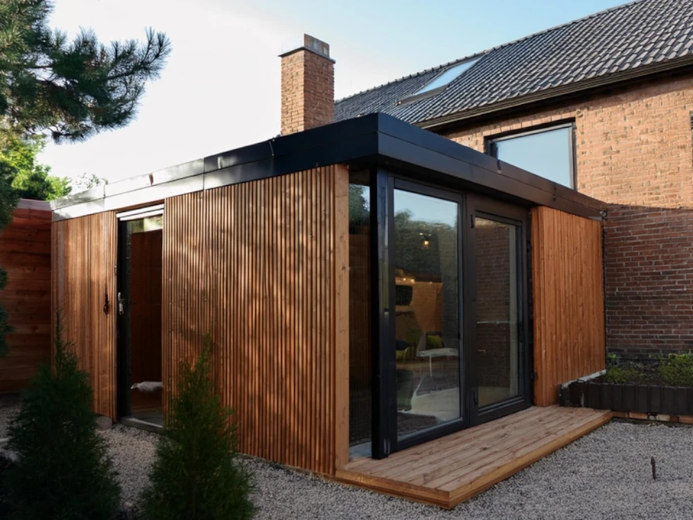 Completed steel SIP extension with cladding and garden doors